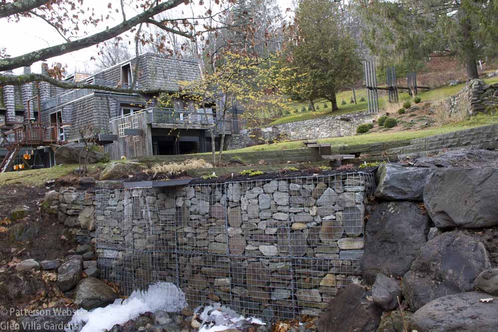 Fieldstones in gabion baskets echo the fieldstones used in the stone walls that surround Glen Villa -- and that are part of its own foundation.