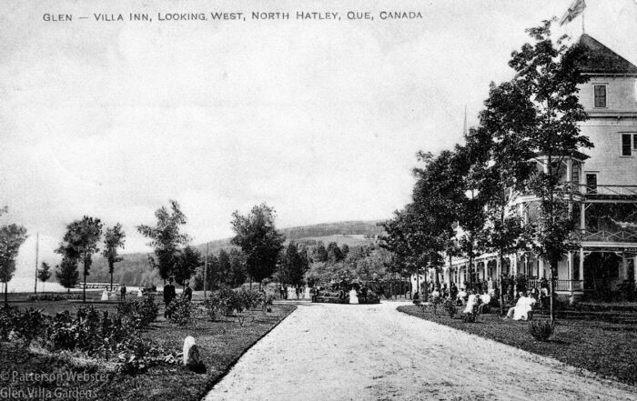 The drive ran in front of the hotel, barely visible on the far right of this old postcard.