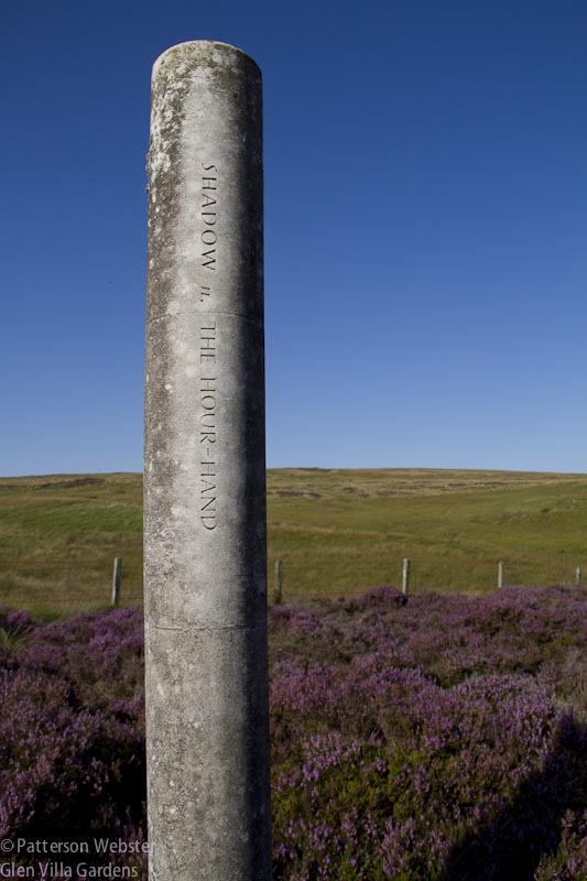 Shadow: the Hour Hand are the words carved into this stone column.