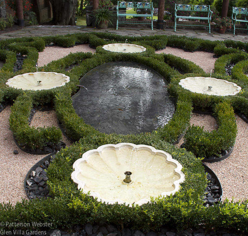 The newly planted boxwood parterre showcases the details of Steele's design.