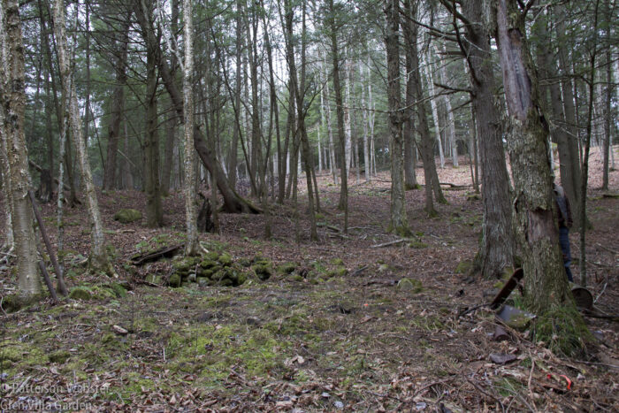 The low stone wall marks the foundation of a sugar camp that once stood on this site. The low stone wall marks the foundation of a sugar camp that once stood on this site.