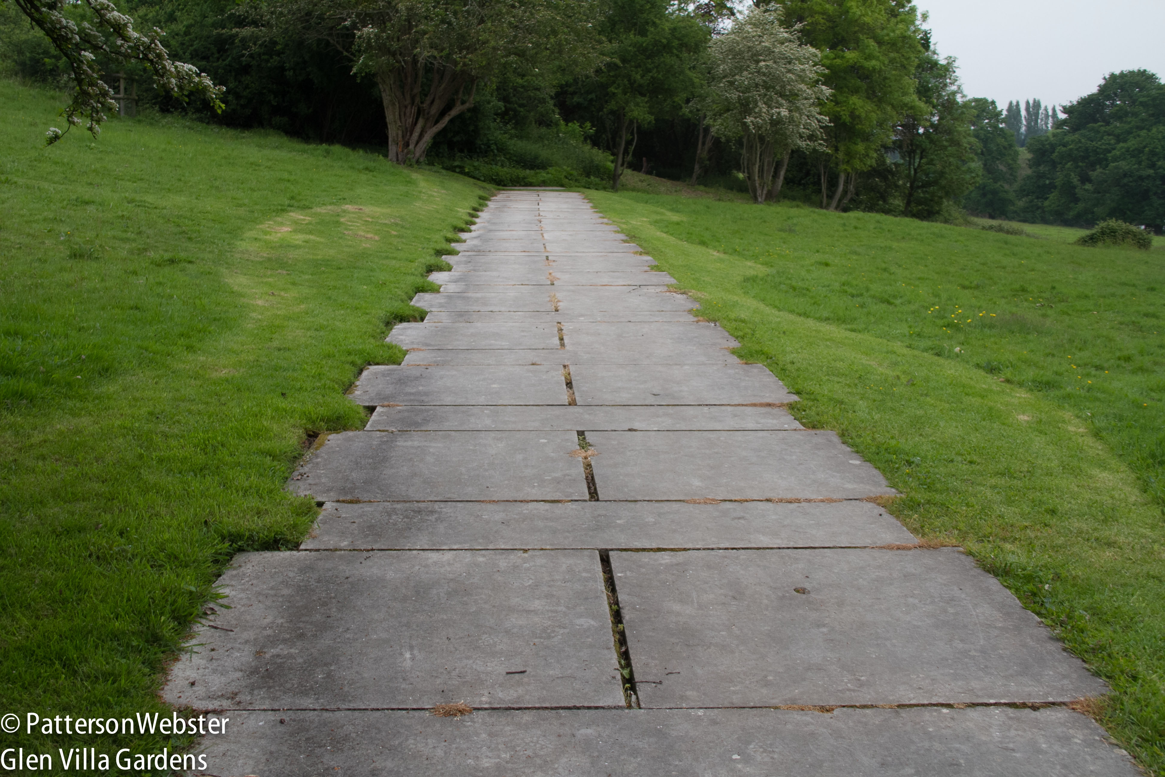 The uneven edge of the path suggests crenallations on a fortified building. The whirly mowing pattern doesn't. 
