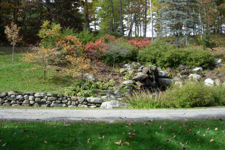 This view from October 2005 shows colourful sumac and a crumbling stone wall.