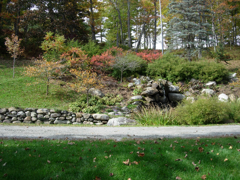This view from October 2005 shows colourful sumac and a crumbling stone wall.
