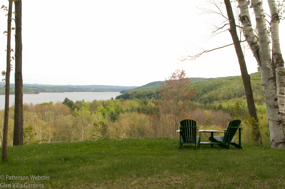 This view of Lake Massawippi is framed by the trees. The pair of chairs in the foreground give a sense of scale and add a human touch.