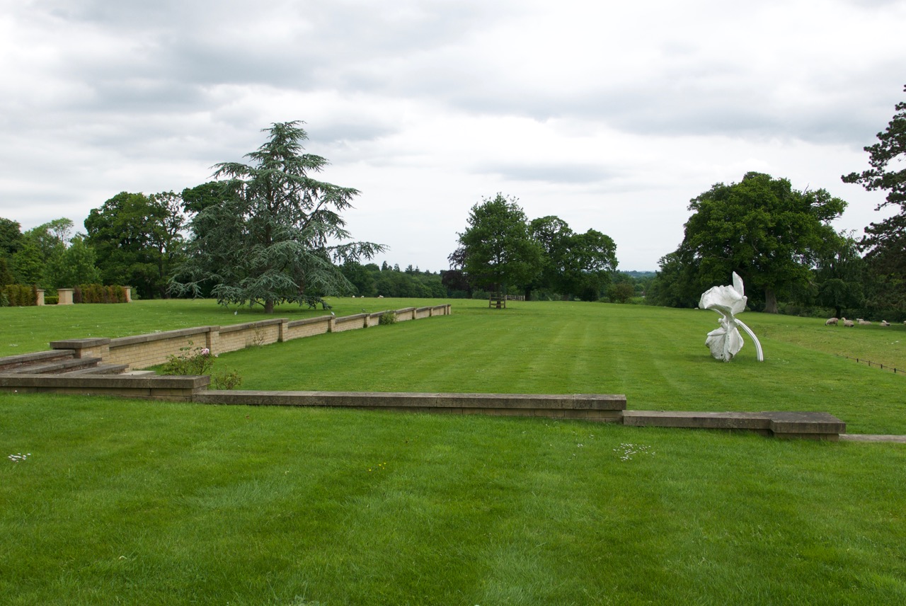 A sculpture by Mark Quinn provides a focal point to the open lawn and the fields beyond.