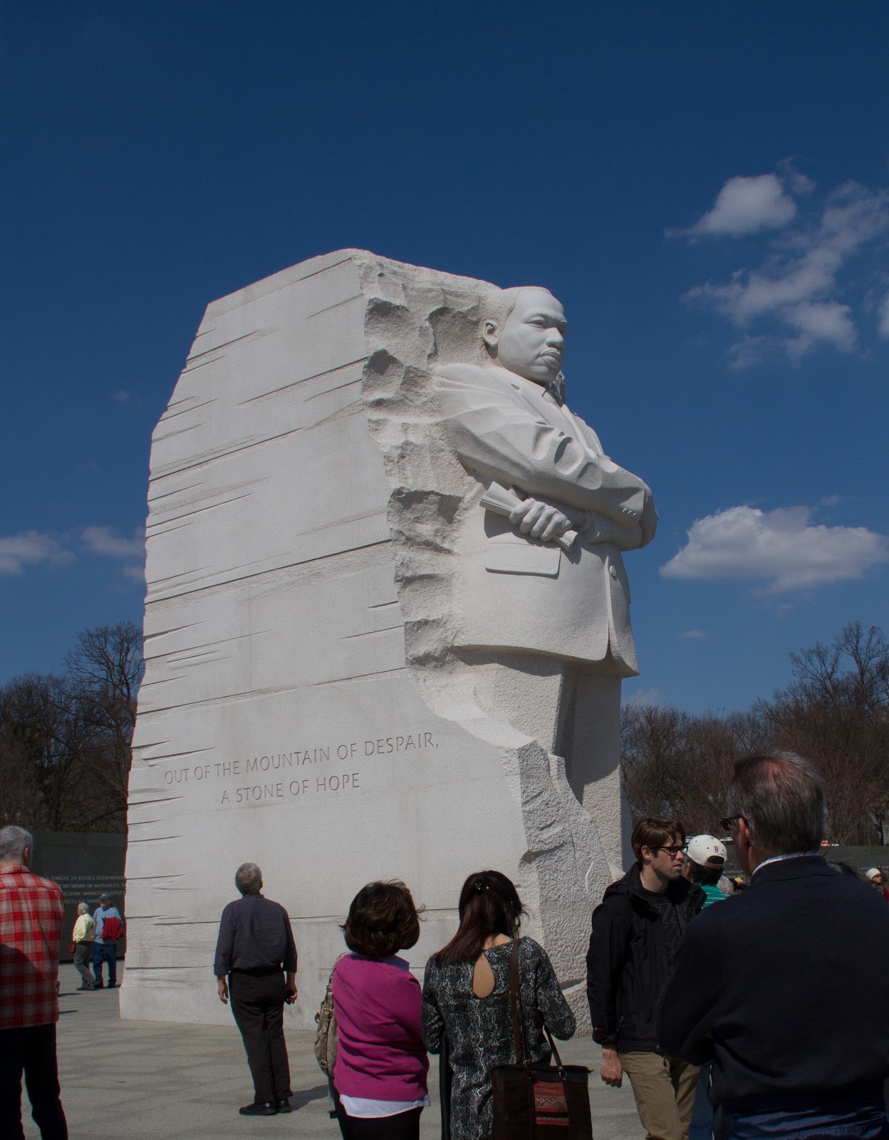 Is Martin Luther King emerging from the rock or is he held in place by it?