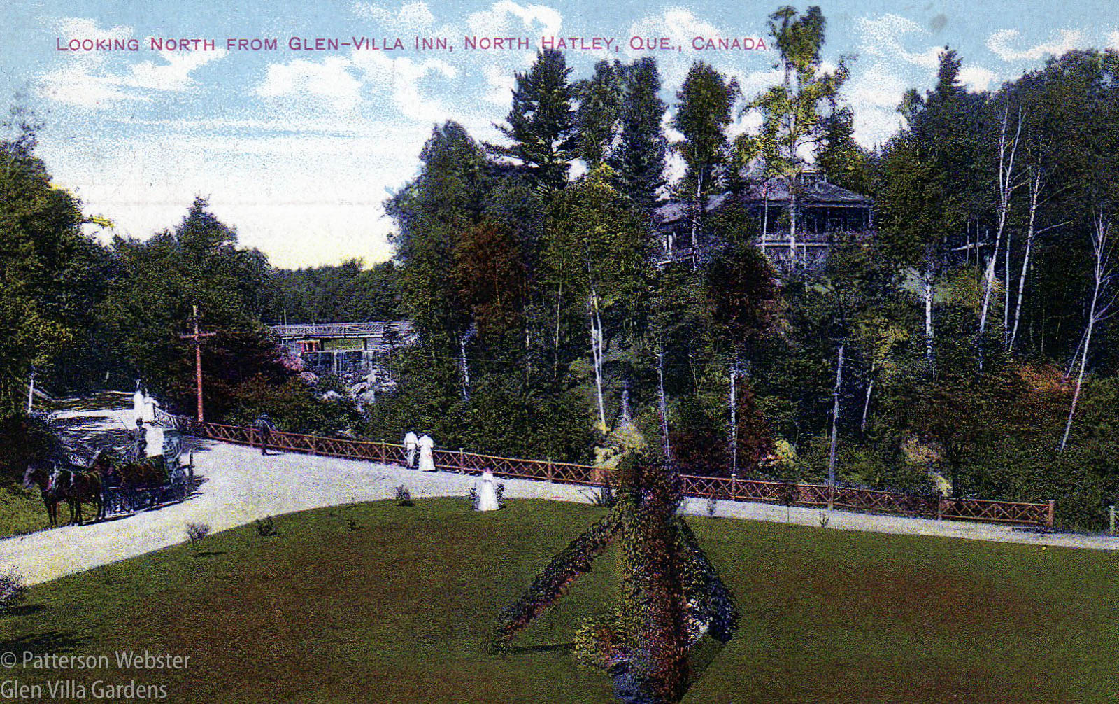 This colour postcard shows the same or a similar flower arrangement. It also shows the dam and waterfall. The building in the distance was the clubhouse for the 9 hole golf course. 