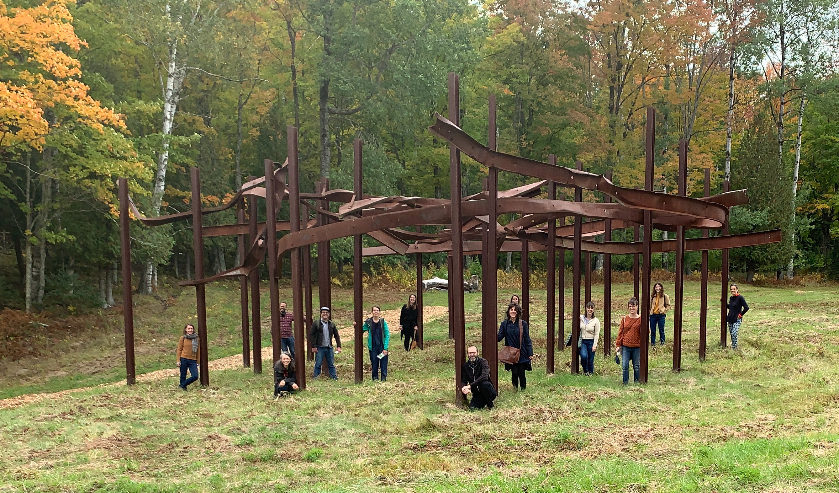 The team from NIP Paysage stand beside Bridge Ascending, a sculpture by Quebec artists Louise Doucet and Satoshi Saito.